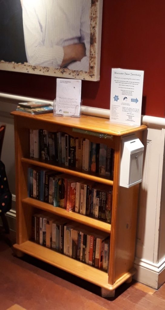 A second hand bookshelf in a cafe